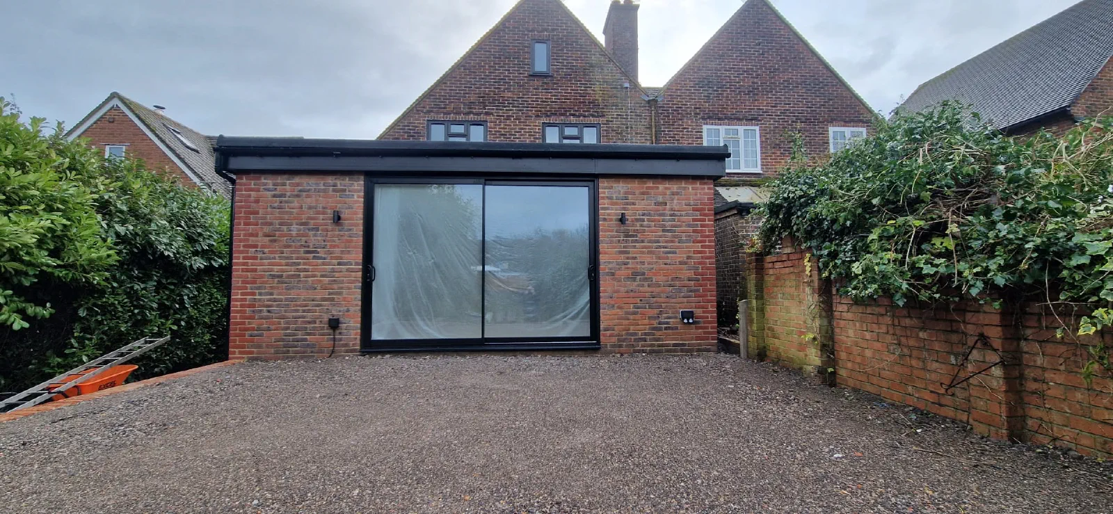 Completed brick rear extension with wide sliding doors