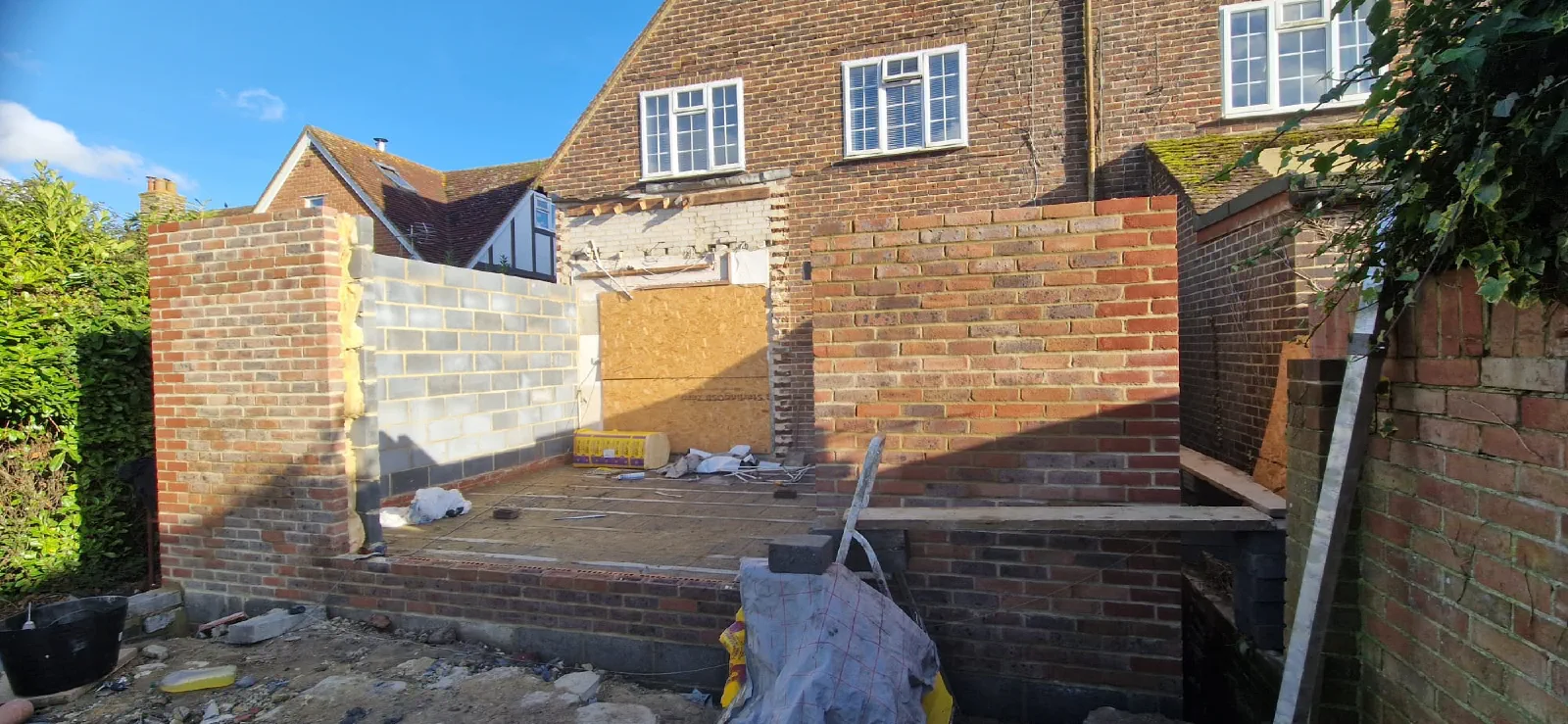 Brick and block walls under construction at the rear of the property
